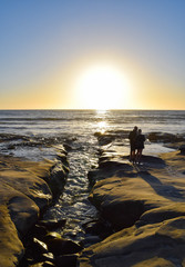 Fototapeta premium Silhouette of Couple at Sunset in La Jolla, California
