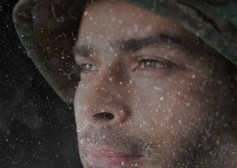 foreground of soldier looking the horizon