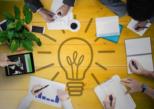 Overhead of business team with yellow wood 