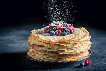 Delicious stack of pancakes with fresh berries and mint - obrazy, fototapety, plakaty
