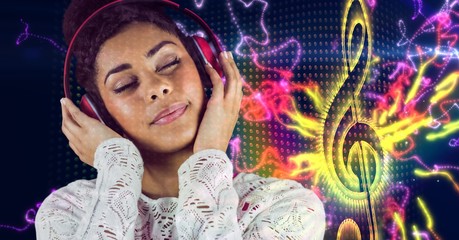 Happy woman listening music with headphones 