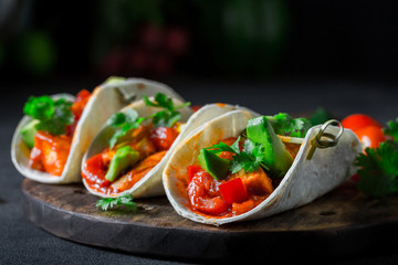 Mexican tacos with spicy sauce and fresh coriander