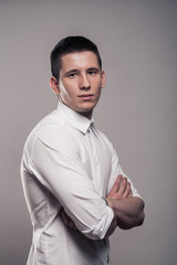 one young man, portrait, upper body, white shirt, side view