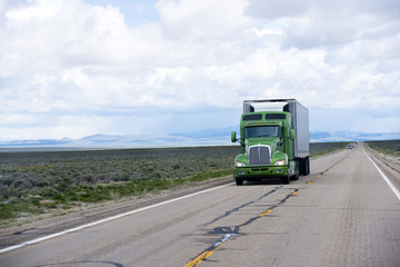 Fototapeta na wymiar Modern American semi truck and reefer trailer on Nevada road