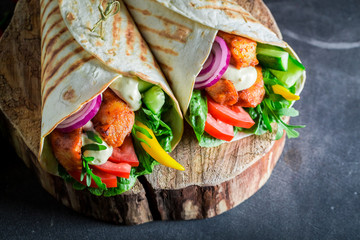 Healthy grilled tortilla with fresh vegetables and chicken