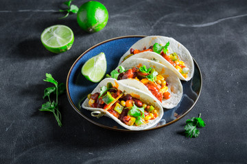 Spicy tacos with meat and spicy tomato sauce