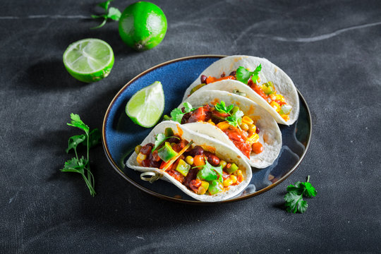 Spicy tacos with meat and spicy tomato sauce