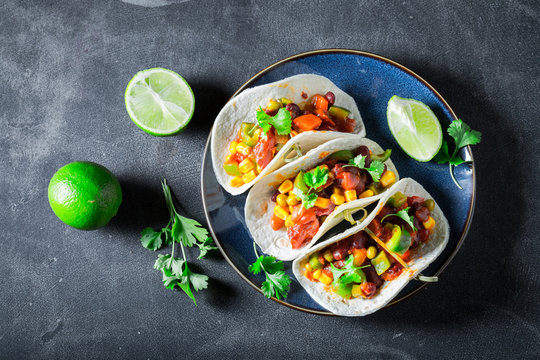 Enjoy your tacos with avocado, lime and tomato sauce