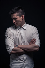 one young man, tense intensive looking ,black background