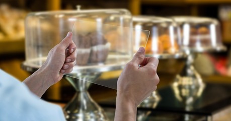 Hand taking picture with transparent device at grocery shop