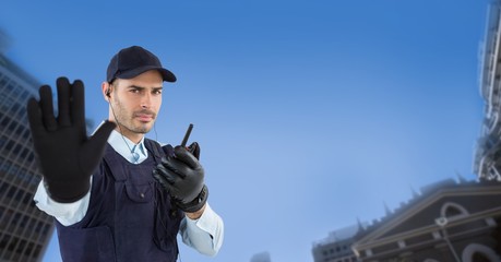 Portrait of security guard showing stop gesture 