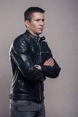 Fototapeta premium young man, sideways, looking sideways ,leather jacket,