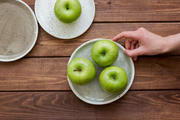 ripe green apples wooden table background top view