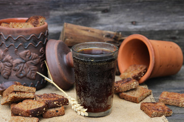 Cold bread kvass on a wooden background