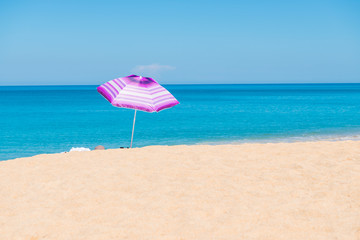 Violet parasol , purple umbrella on the beach
