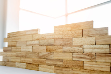 the blocks wood tower game with architectural engineer plans or blue prints compasses ,pencils and ruler on wooden table, plan and building concept