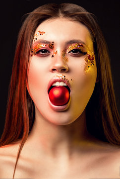 Portrait of a girl, model with beautiful, creative make-up in the studio with color filters. Beauty, portrait, style, fashion, make-up, filters.