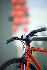 Fototapeta na wymiar Red bright modern bike with lock on the frame