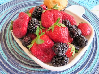 An assortment of berries; fresh, ripe strawberries and blackberries