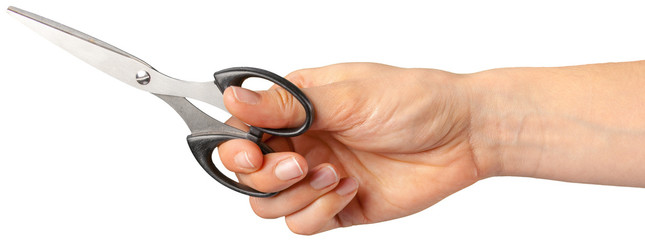 the hand of a Barber holding a scissors
