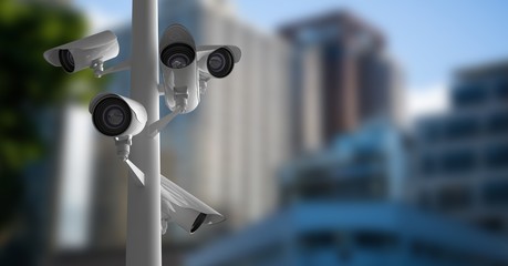 CCTV cameras against defocused buildings