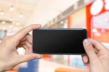 Close up of a man using mobile smart phone