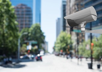 Obraz premium CCTV camera against defocused buildings