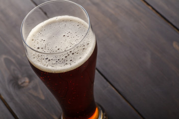 Tall glass of amber ale