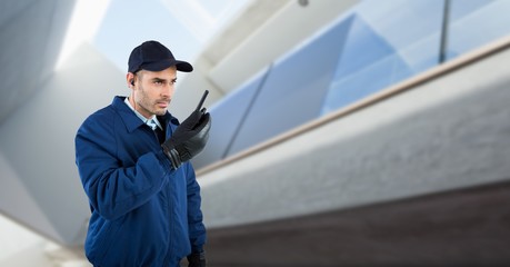 Security guard talking on walkie talkie 