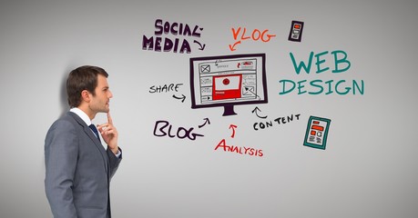 Thoughtful businessman looking at text and symbols