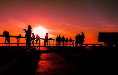 Many tourists watch the morning sunrise on the mountain.