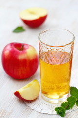 Apple juice and apples on the table