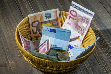 basket with money from donations