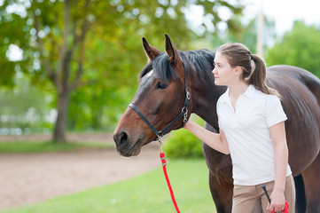 Best friends. Young teenage girl together with her horse