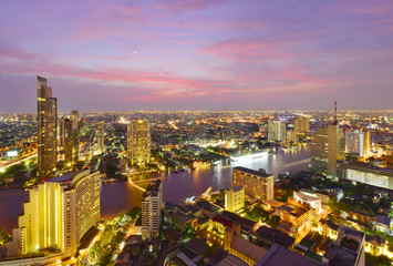 Fototapeta na wymiar Bangkok river view at Dusk with modern business building along the Chao Phraya river ,Thailand