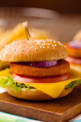 Delicious fish burgerserved with fresh french fries.
