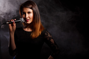 Young girl sings in studio