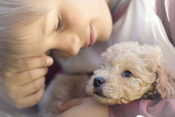 A magical moment of sweetness between a puppy of a man and a puppy dog