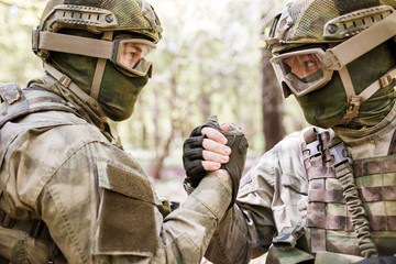 Two military men shaking hands