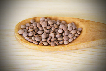 Wooden spoon with lentils