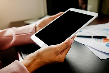 Woman using mobile phone with hand, touch screen. Project Manager Researching Process. Business Team Work Startup modern Office.