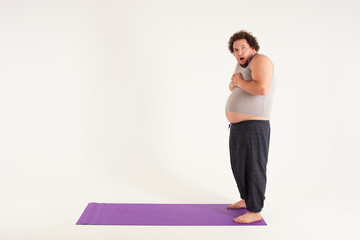 Funny fat man and yoga. Sport, diet and a healthy lifestyle.  