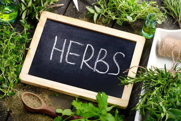 Garden fresh herbs on a wooden table