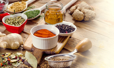 Spices on  rustic wooden background.