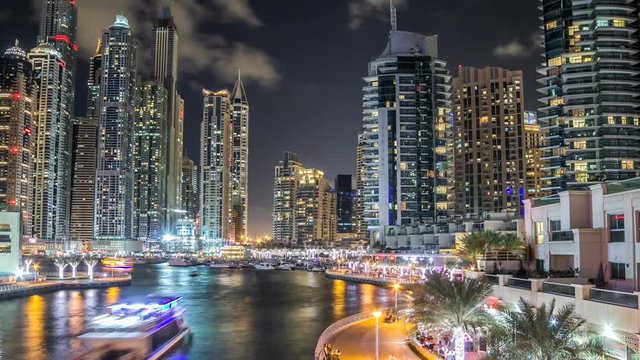 View of Dubai Marina Towers and canal in Dubai night timelapse hyperlapse
