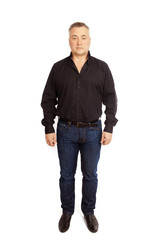 An elderly man is standing frontally