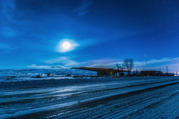 Empty track in the winter moonlit night