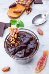 Mousse of chocolate with peanuts and candied fruits
