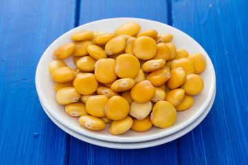 salted lupins on white plate