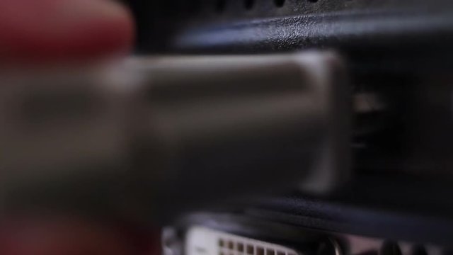 DVI connector on graphics card, Hand connects plugs in a DVI, Connecting monitor to a computer